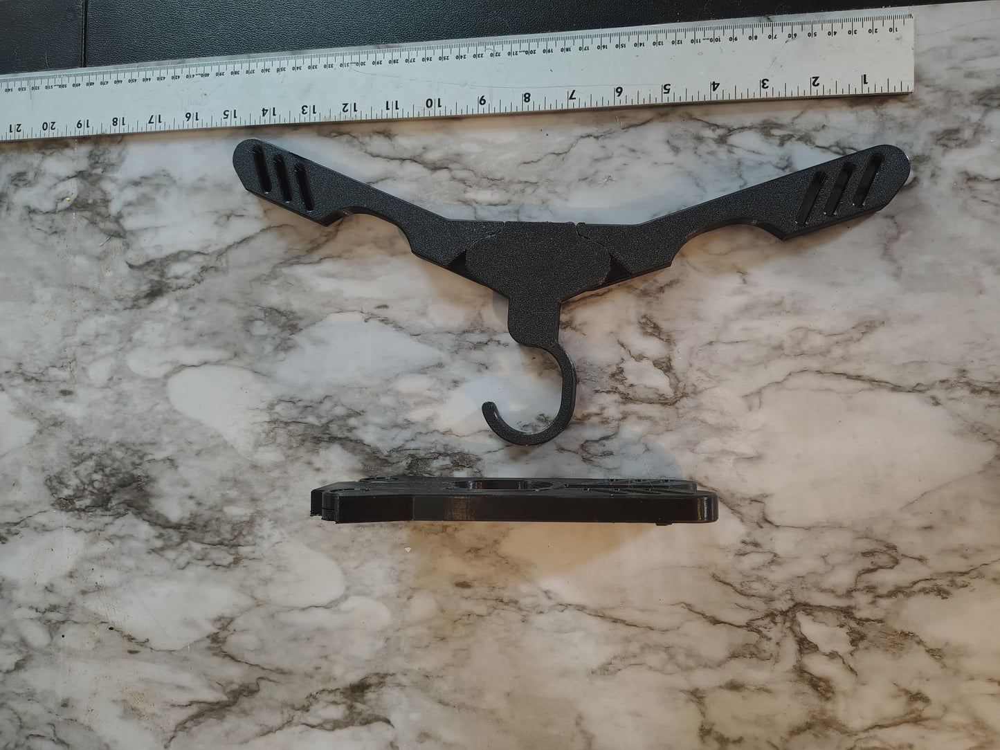 Collapsible travel heavy duty hanger for clothing for the businessman. Woman packs up small opens up strong
