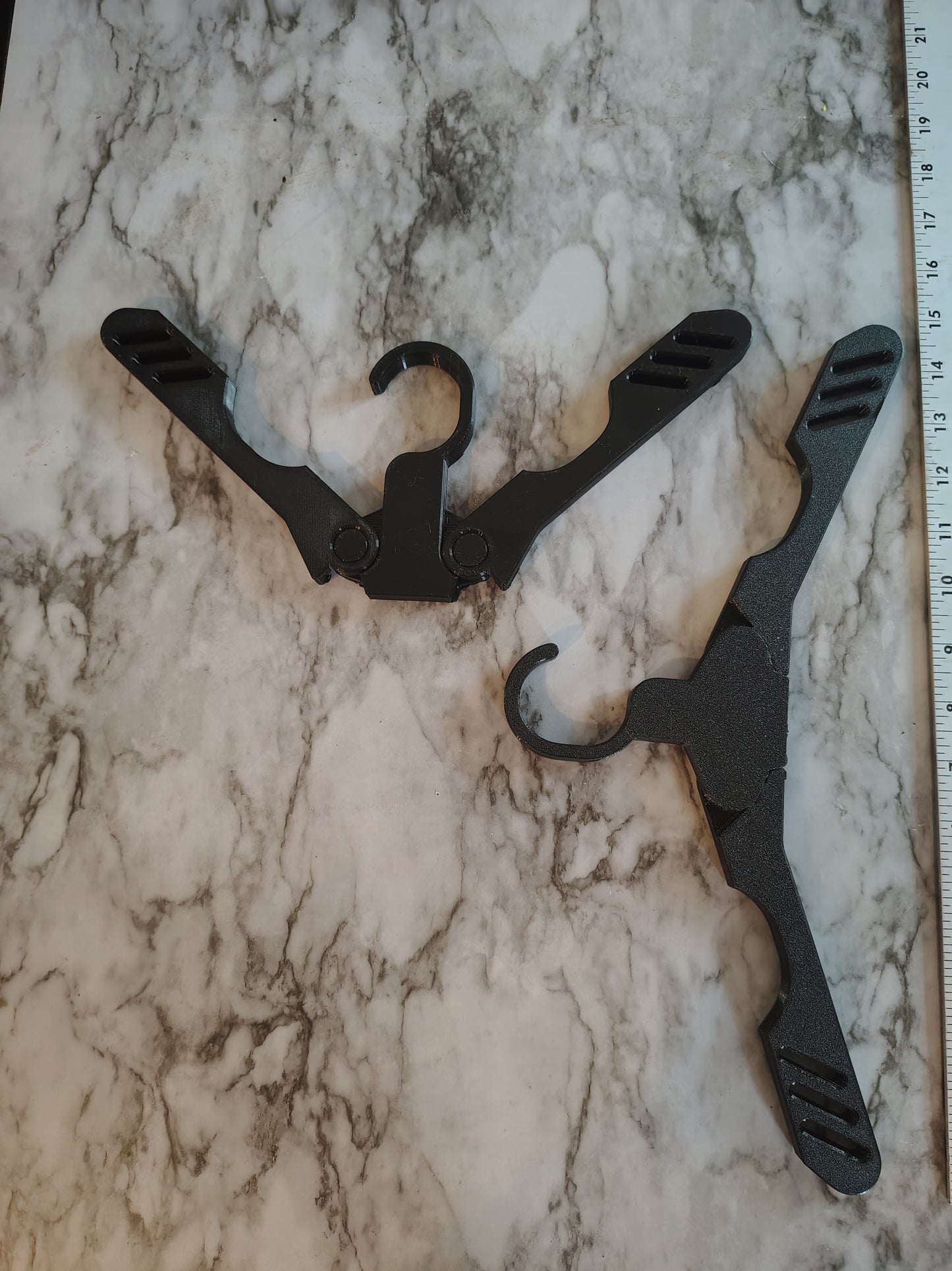 Collapsible travel heavy duty hanger for clothing for the businessman. Woman packs up small opens up strong